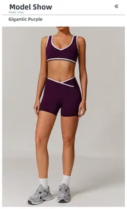 Detail of high-waisted cross-waist yoga shorts in grape purple with white piping