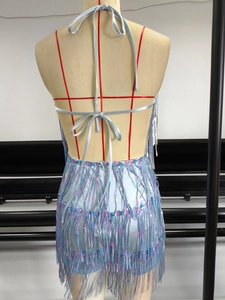 Detail view of blue sequin tassel dress back on mannequin with shimmering fringe texture