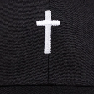 Vintage mesh trucker hat featuring white cross embroidery on black cotton twill front