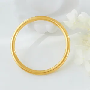 Minimalist matte gold round bangle bracelet for couples with a sleek geometric design