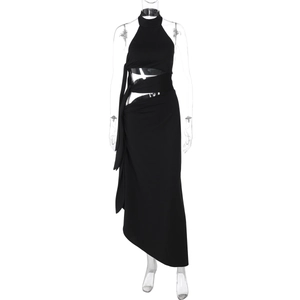 Close-up of sexy black halter neck maxi dress with waist cut-out and tie detail