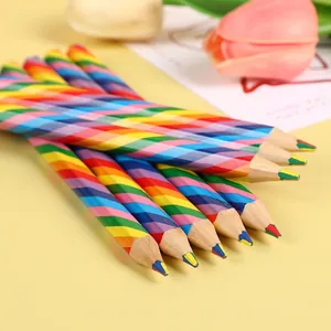 Set of creative rainbow pencils with multi-color 4-in-1 leads on a bright yellow surface