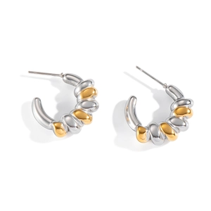 Two-tone geometric twisted hoop earrings in polished gold and silver finish