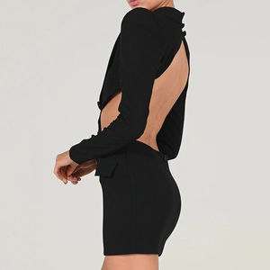 Detail showing side and back cutout design on a black long-sleeved bodycon dress