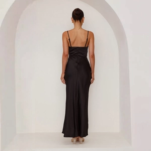 Close-up of sleek black satin maxi dress with back zipper and thin shoulder straps
