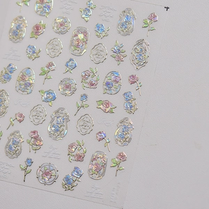 Macro detail of laser holographic rose stickers with vintage gold frame patterns