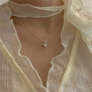 Elegant 925 sterling silver heart necklace with crystal zircon on female model