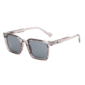 Stylish square frame sunglasses in transparent brown with grey lenses, 45-degree angle view