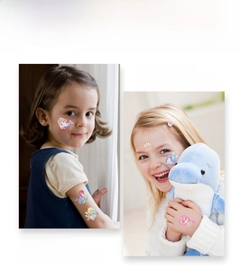 Detail of glitter watercolor mermaid tattoo stickers applied on child's arm and face