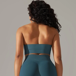 Detail of teal ribbed seamless sports set showing open back design and texture