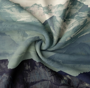 Detail of mountain print tapestry fabric with soft texture and artistic ink design