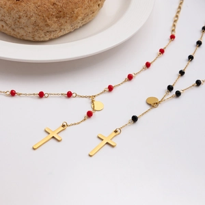 Detail of 18K gold plated stainless steel rosary necklaces with black and red glass beads