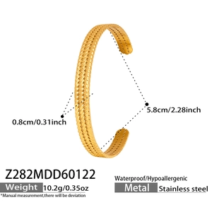Macro view of gold PVD plated stainless steel cuff with woven texture and 0.8cm width specs