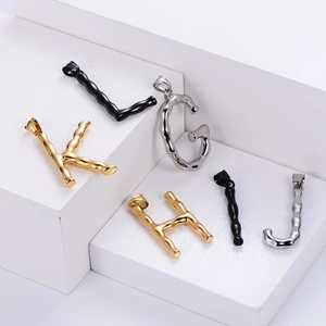 Polished stainless steel alphabet pendants with bamboo texture in gold, silver and black