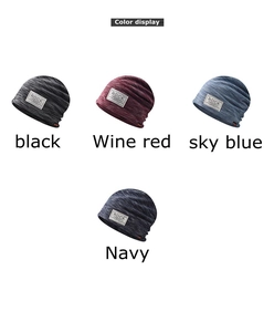Close-up of knit beanie hats with ROCK label showing fabric texture in multiple colors