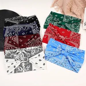 Seven colors of paisley print knot headbands in elastic fabric for sports and yoga