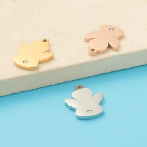 Detailed view of polished angel pendants in gold, rose gold, and silver with small crystals