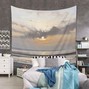 Detail of bohemian sunset beach tapestry hanging as a bedroom wall art decoration
