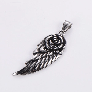 Vintage silver angel wing pendant with 3D rose flower detail on white background