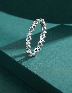 Macro shot of S925 sterling silver hollow heart ring with inlaid sparkling zircon stones