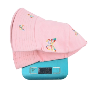 Pink butterfly embroidered bucket hat for sun protection weighing approximately 85 grams
