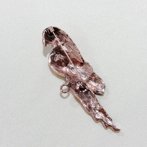 Detailed back view of vintage rose gold bird brooch showing pin clasp and brushed texture