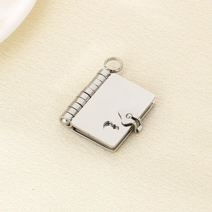 Macro view of a silver envelope book pendant with heart buckle for laser engraving