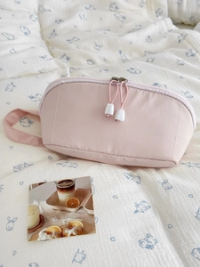 Minimalist light pink large capacity cosmetic bag with dual zippers and handle strap