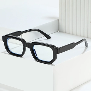 Modern black square glasses frame with anti-blue light lenses on a geometric stone base