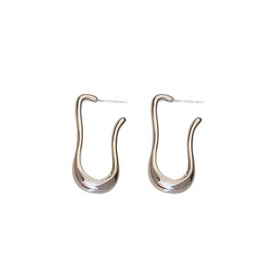 Irregular silver U-shaped metal stud earrings with high-polish mirror finish and minimalist design