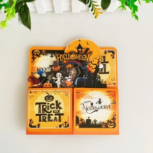 Top-down view of 3D Halloween pop-up card with pumpkin, ghost, and haunted house details