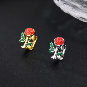 Detailed rose flower charm in gold and silver finish with red petals and green leaves