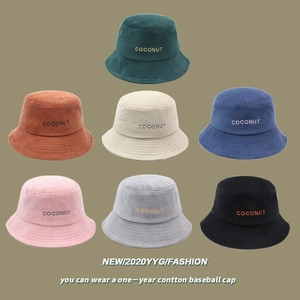 Corduroy bucket hats in multiple colors like navy and orange with Coconut embroidery