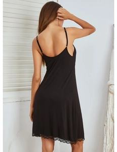 Macro shot of black modal nightdress featuring delicate eyelash lace trim at the hemline
