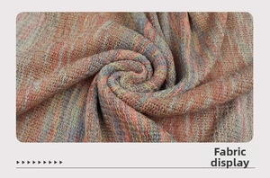 Detailed close-up of the colorful striped knit fabric texture with soft wool-like feel