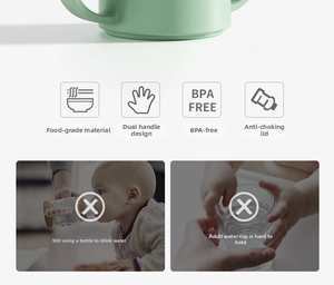 Detail of mint green baby sippy cup with dual handles and BPA-free anti-choke lid design