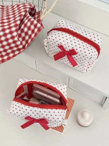 White quilted heart print cosmetic bag with red bow and heart pattern decoration