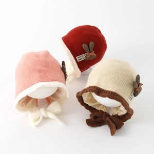 Winter knitted baby hats with plush brim, chin ties and cute bow accents in three colors