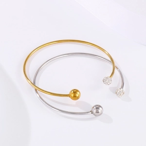 Bracelets ouverts en C dorés et argentés avec des boules ornées de strass brillants