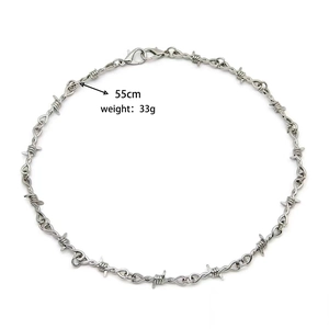 Barbed wire necklace detail showing 55cm length and 33g weight on white background