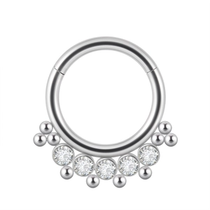 Detail of silver nose hoop featuring five round cubic zirconia and small metal beads