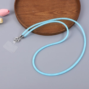 Close-up of light blue glitter fabric phone lanyard with silver metal clips and clear connector