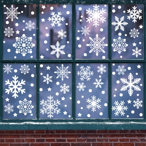 White snowflake window stickers and stars for festive Christmas glass decoration