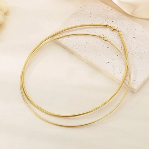 Detailed macro view of 18K gold plated snake chain necklaces with lobster clasp closures