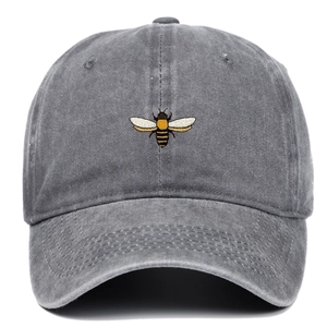 Close-up of vintage washed cotton baseball cap featuring detailed bee embroidery