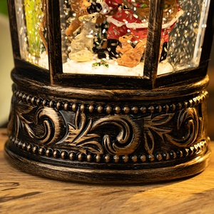 Vintage bronze Christmas musical snow globe lantern with Santa Claus and festive glitter