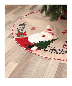 Detail of embroidered Santa Claus motif on beige linen Christmas tree skirt with red trim