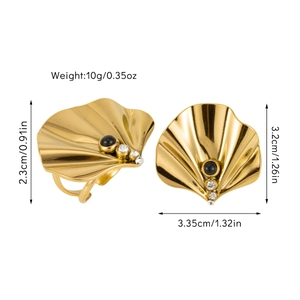 Detail of fan-shaped golden ring with black onyx and sparkling white rhinestones