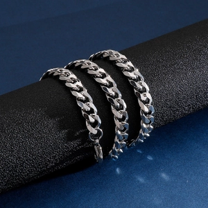Detailed view of silver stainless steel Cuban link chain with lobster clasp on display