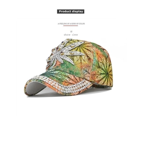 Macro detail of vibrant floral baseball cap with ornate pearl and rhinestone leaf pattern